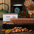 Turrón de almendra Migaya - chocolate con leche, palitos de almendra, galleta y piel de naranja